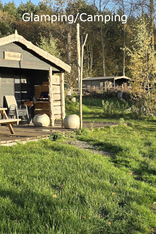 A link image to the glamping and camping page showing one of the glamping cabins